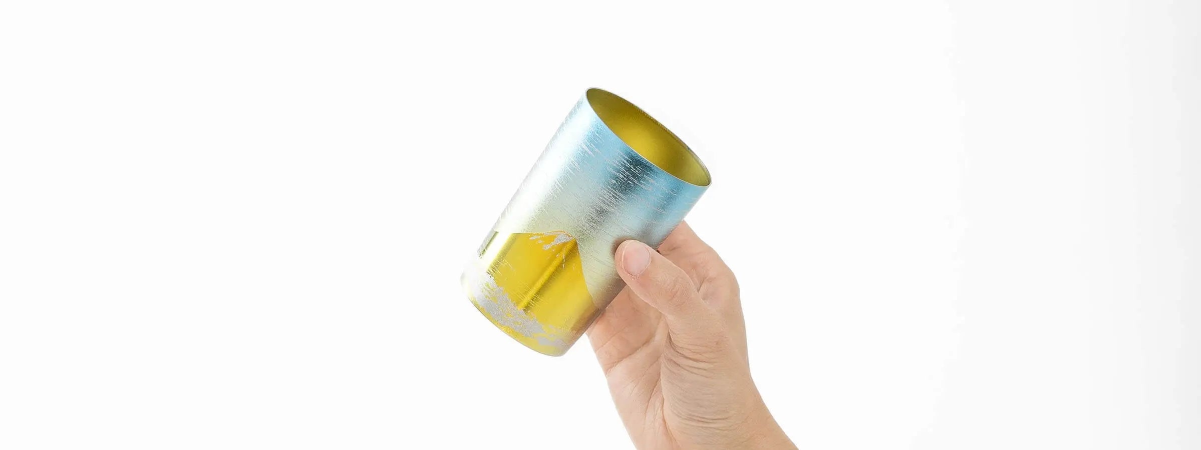 HORIE Fuji Series double-walled titanium tumbler with Mt. Fuji design, Japanese artisan drinkware held in hand Made in Japan.