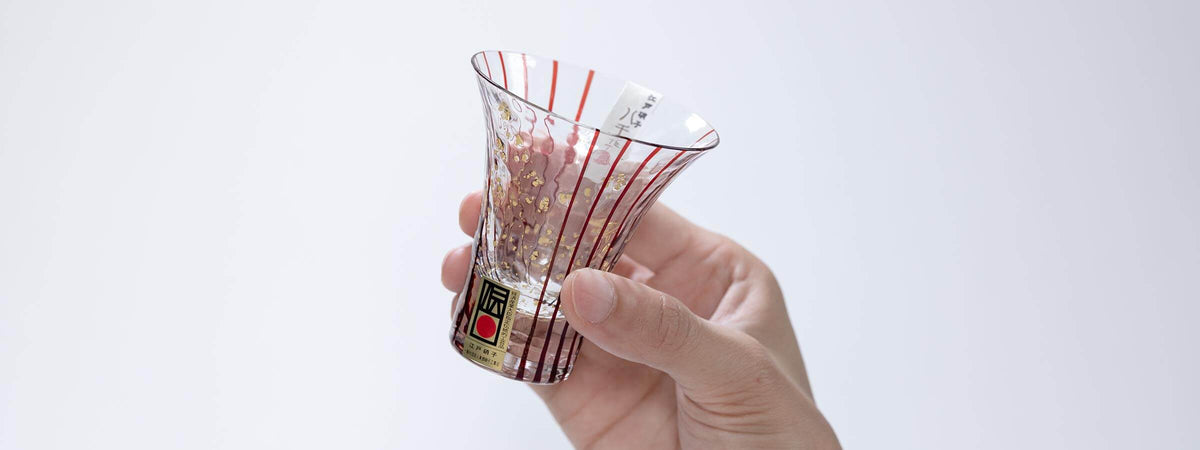 Toyo Sasaki Yachiyo Kiln Hanamizake handblown Edo glass sake cups held in hand