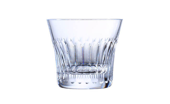 Baccarat crystal whiskey glass featuring 24 exquisite hand-cut facets for brilliant light refraction.