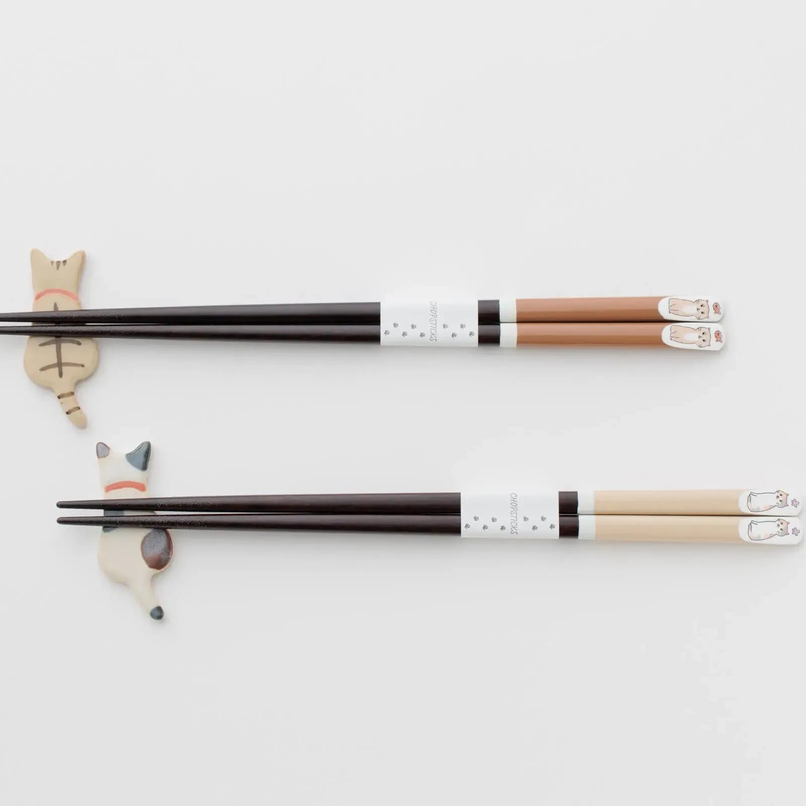 Brown and beige cat-themed chopsticks, 23cm, displayed on ceramic cat chopstick rests.