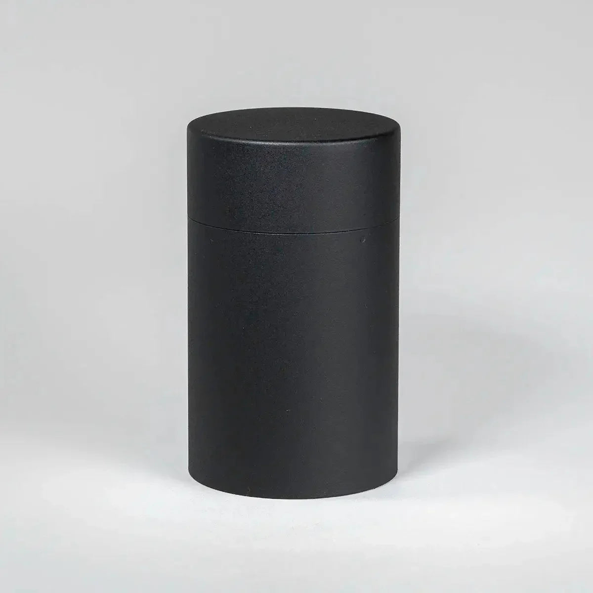 Front view of the CHAKI Tea Canister - Black, stainless steel body and lid