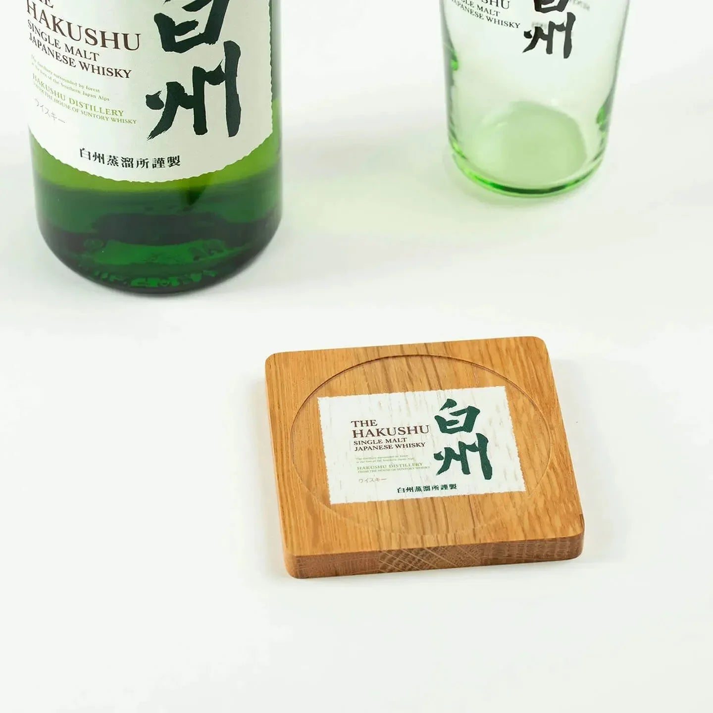 The square Hakushu cask oak coaster, featuring the classic Japanese single malt whisky label design.