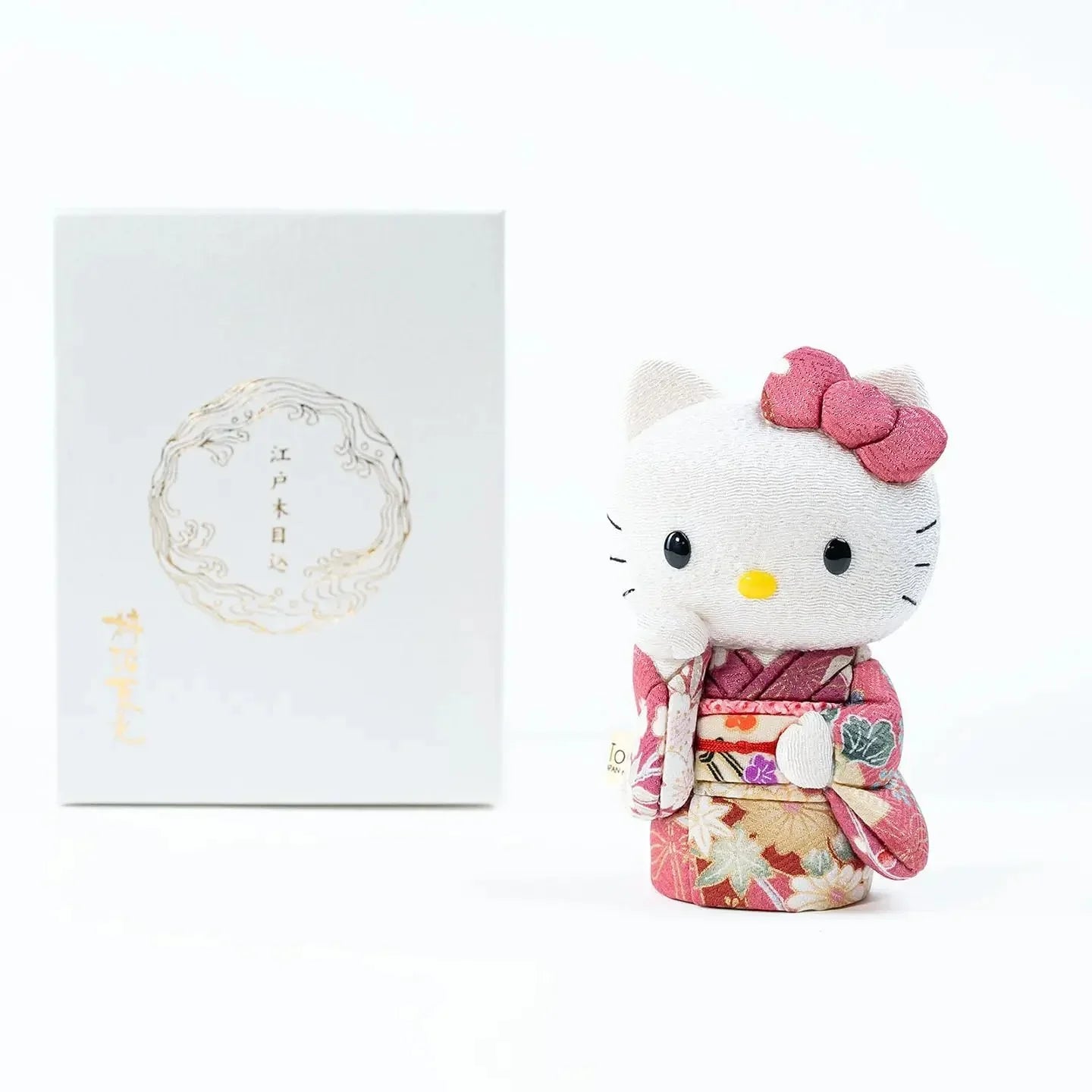 Hello Kitty lucky cat doll in a pink floral kimono.