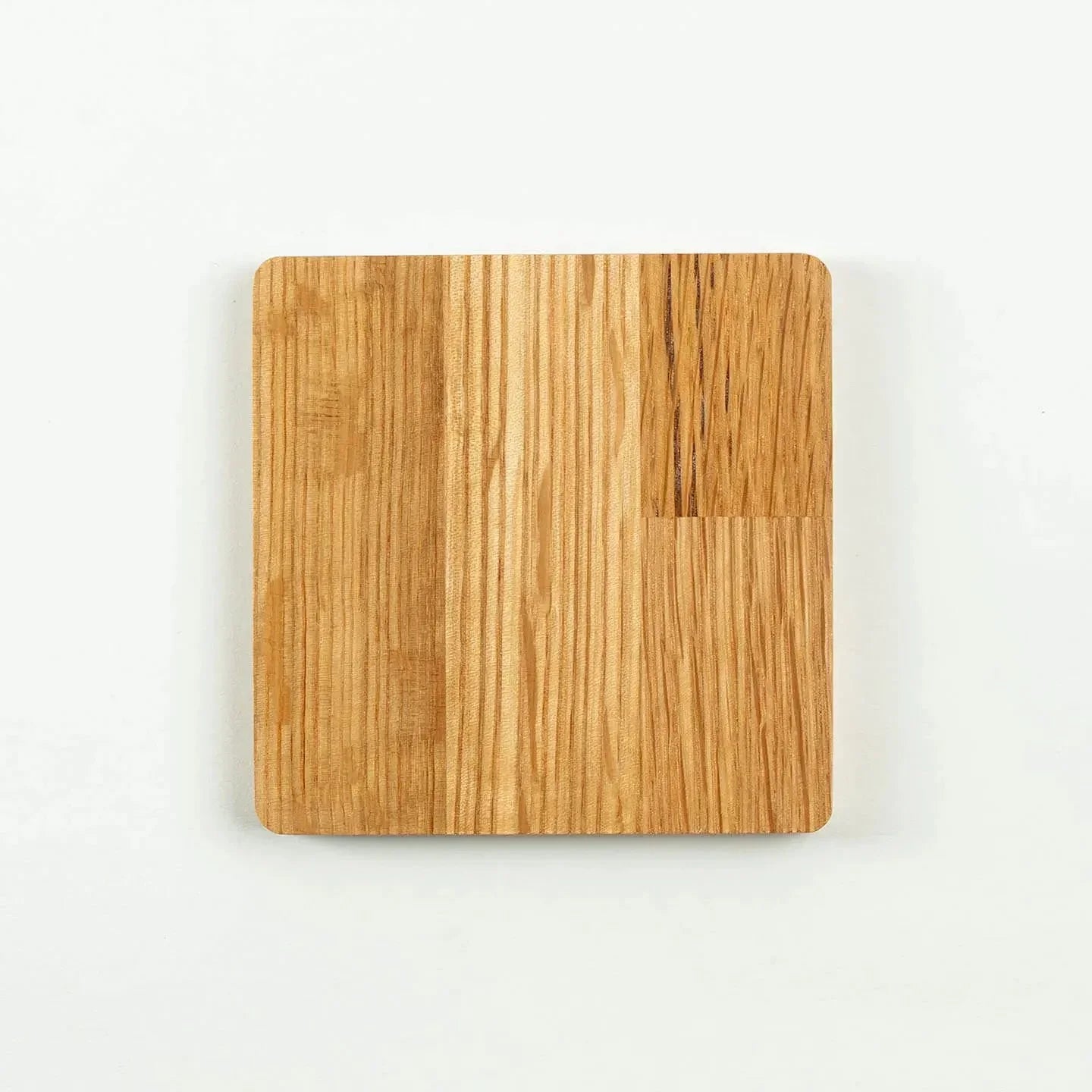 The square Hibiki cask oak coaster, featuring the classic 'Japanese Harmony' whisky label design.