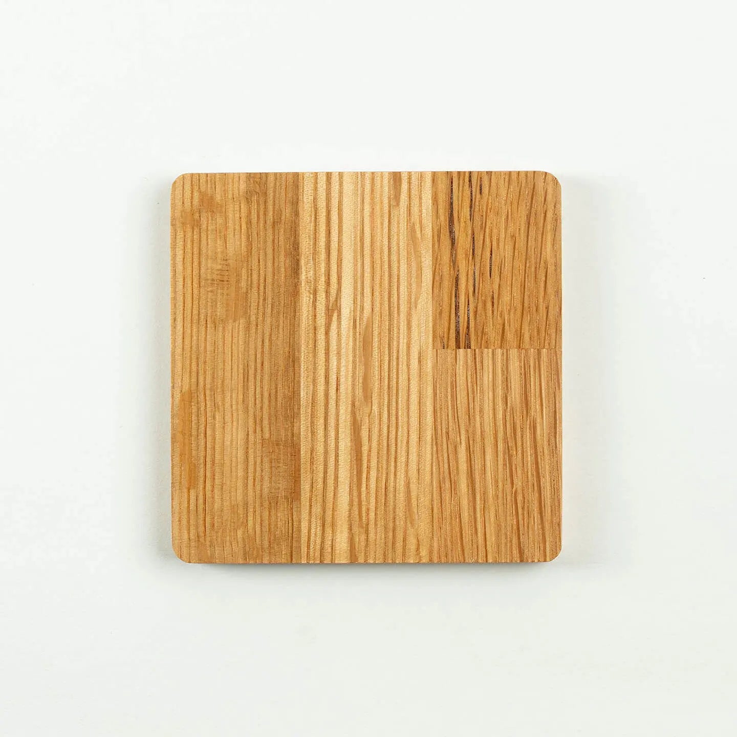 The square Hibiki cask oak coaster, featuring the classic 'Japanese Harmony' whisky label design.