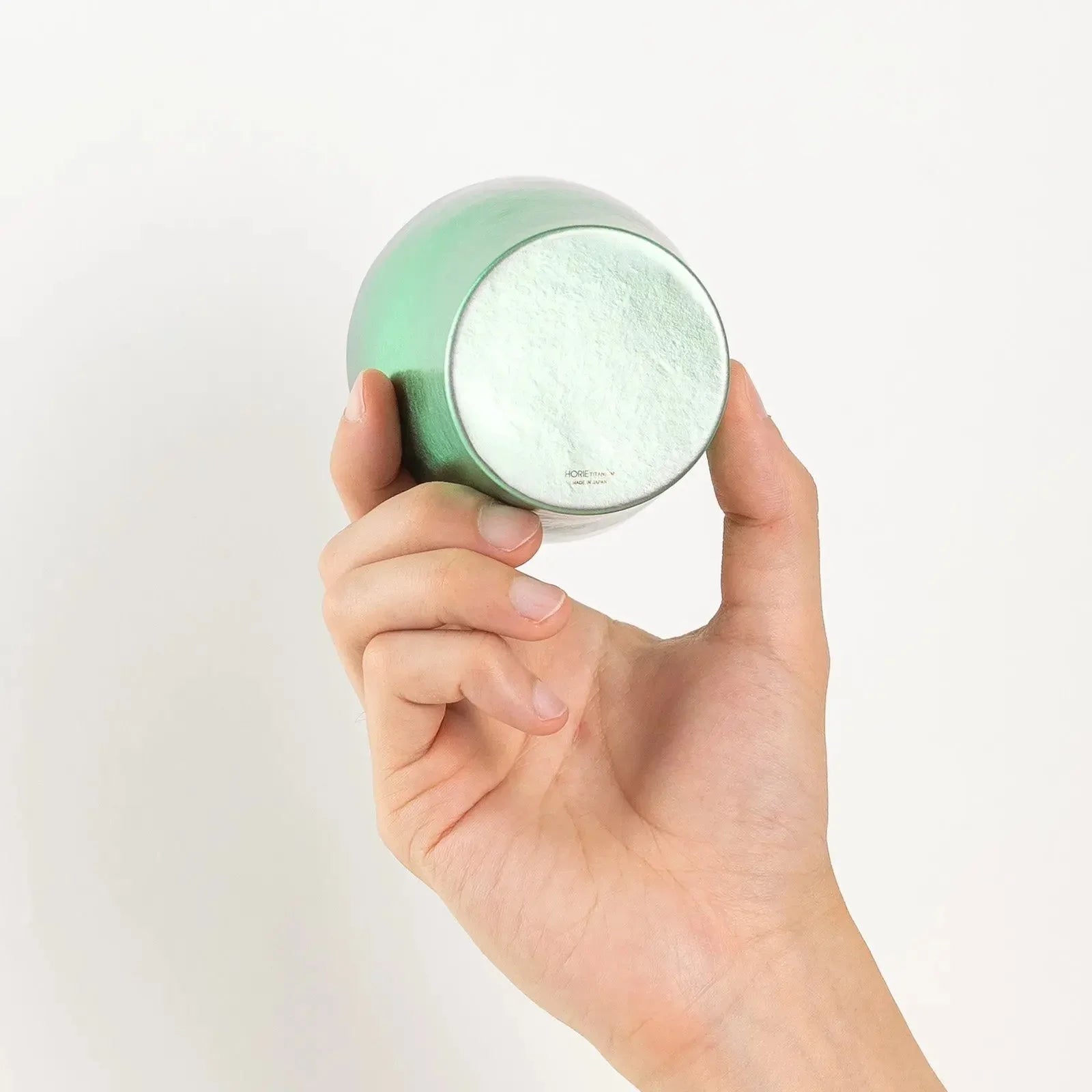 Bottom of HORIE tumbler shown in hand