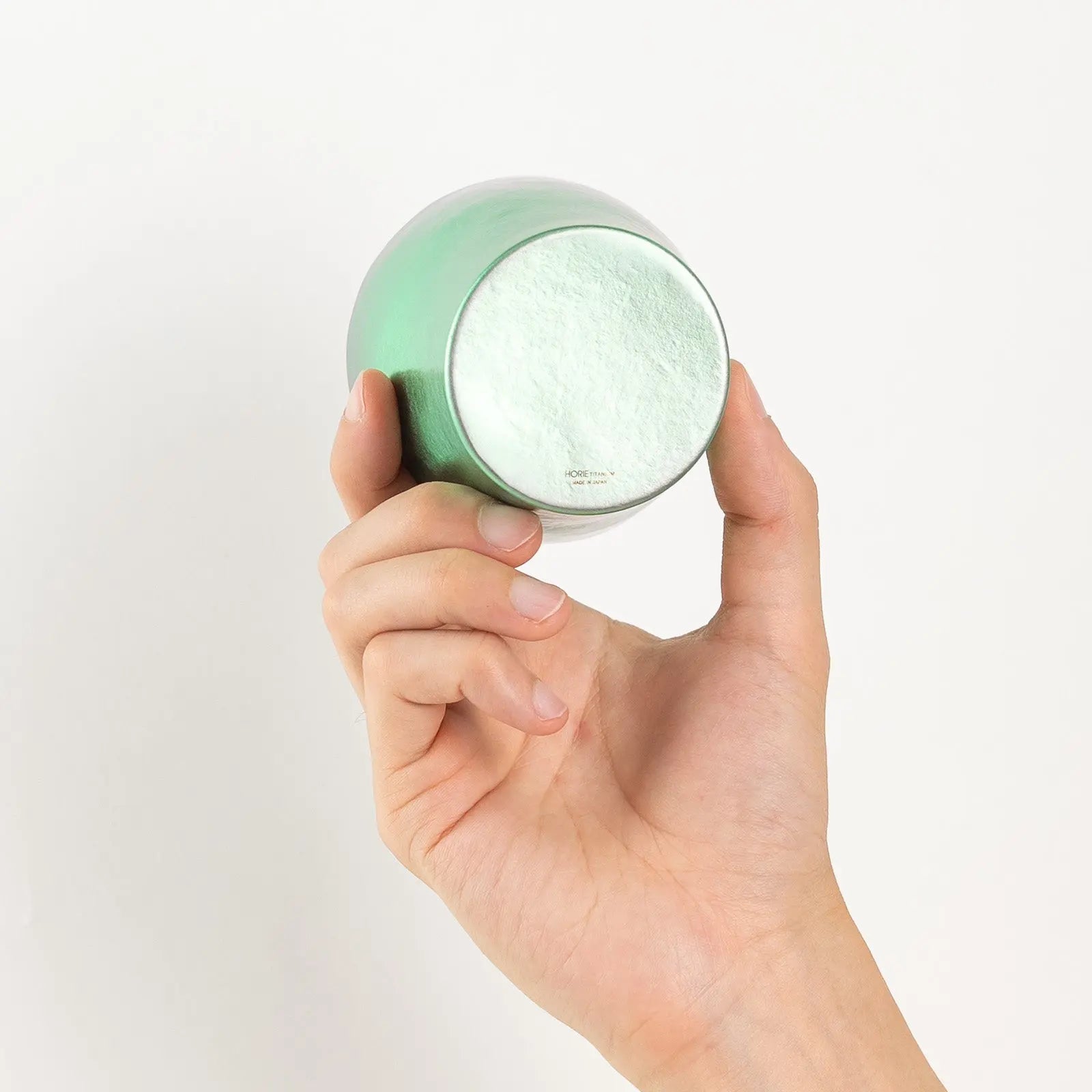 Bottom of HORIE tumbler shown in hand