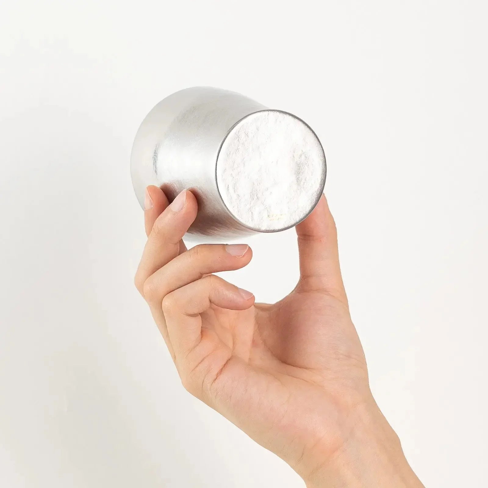 Base logo detail of silver titanium tumbler by HORIE