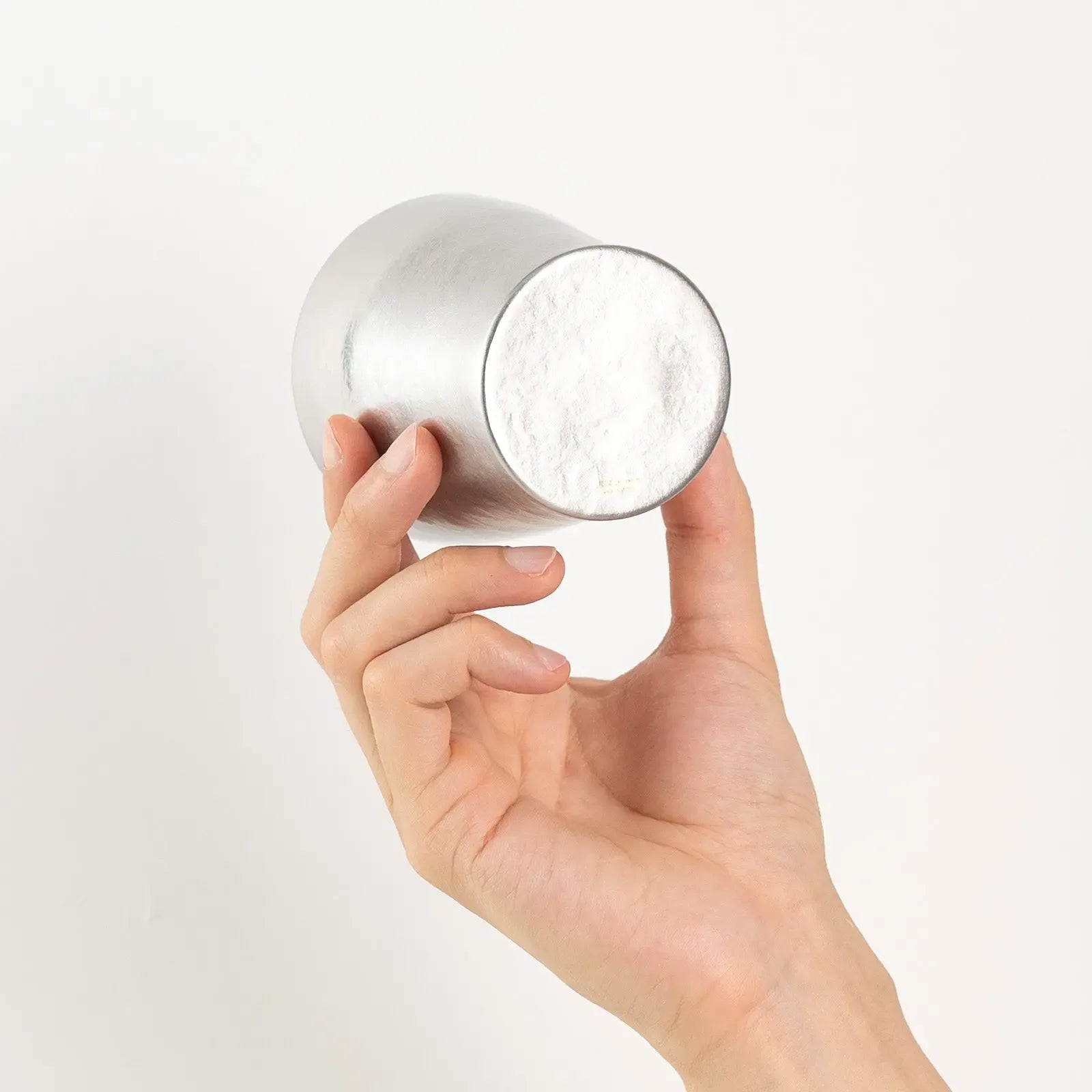 Base logo detail of silver titanium tumbler by HORIE