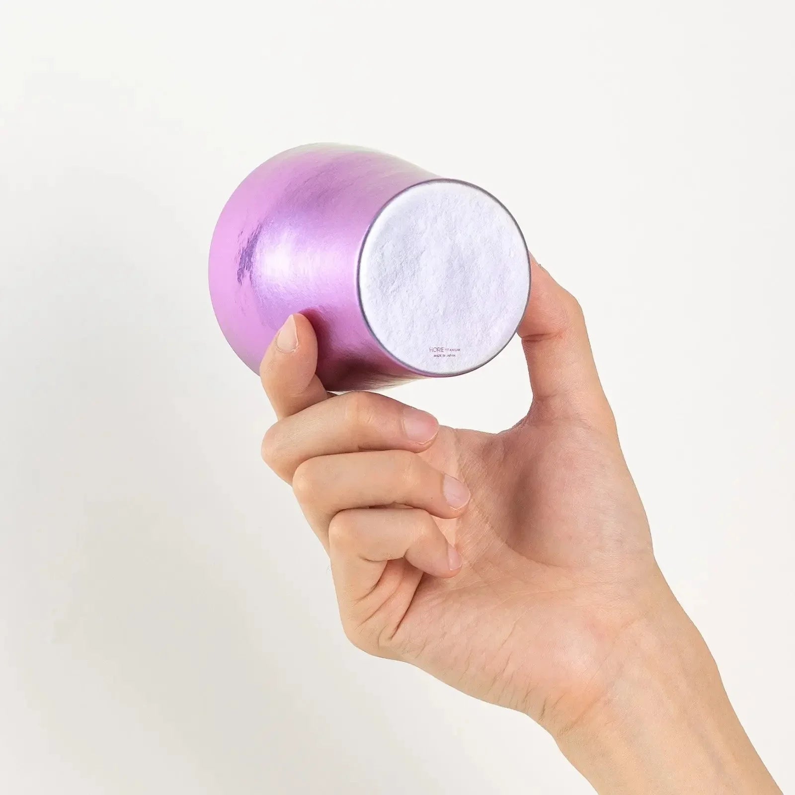 Logo detail on bottom of violet rainbow titanium tumbler