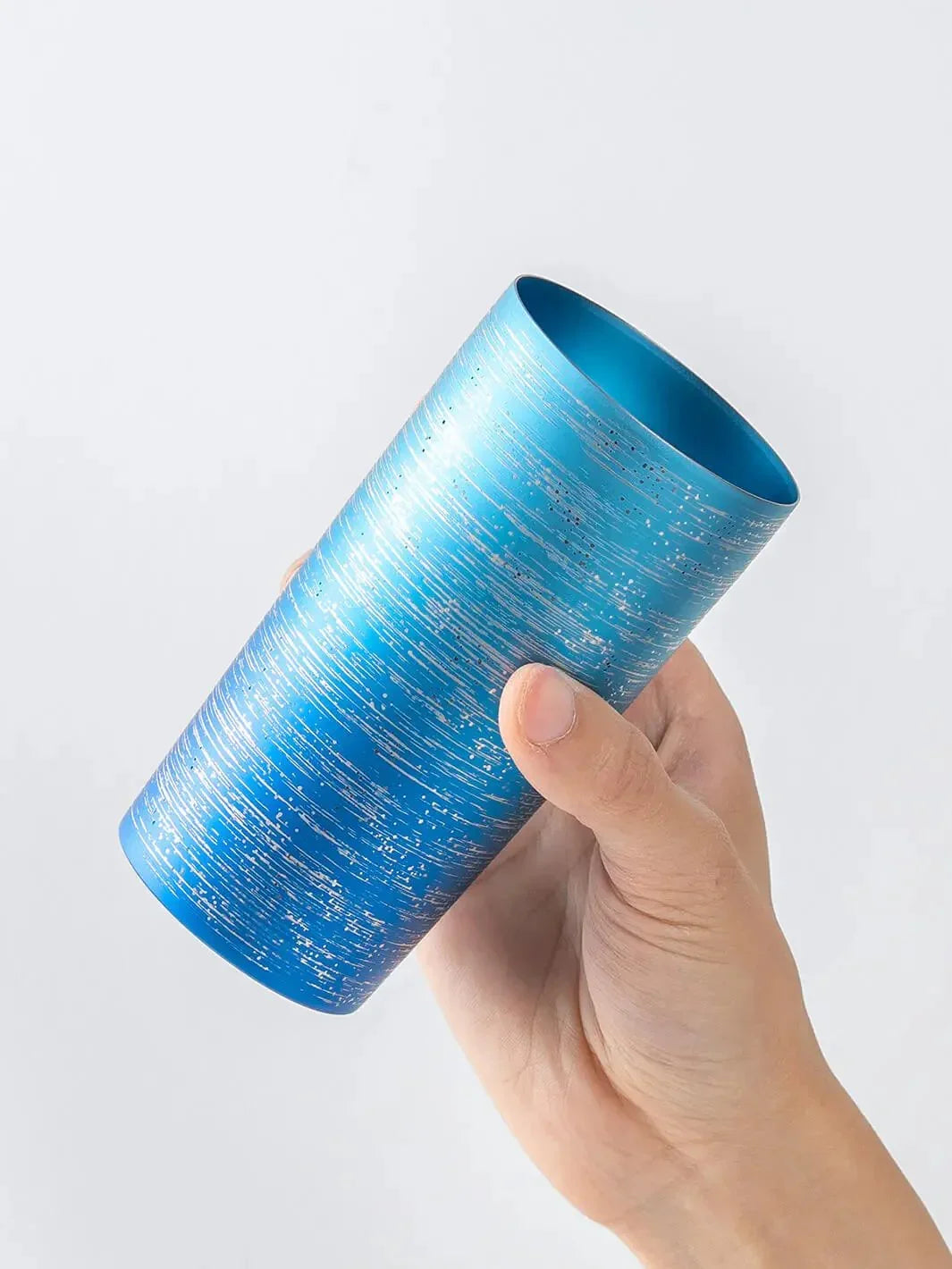 Slightly top-angled view of HORIE Ryo Ocean Blue tumbler (350ml) in hand
