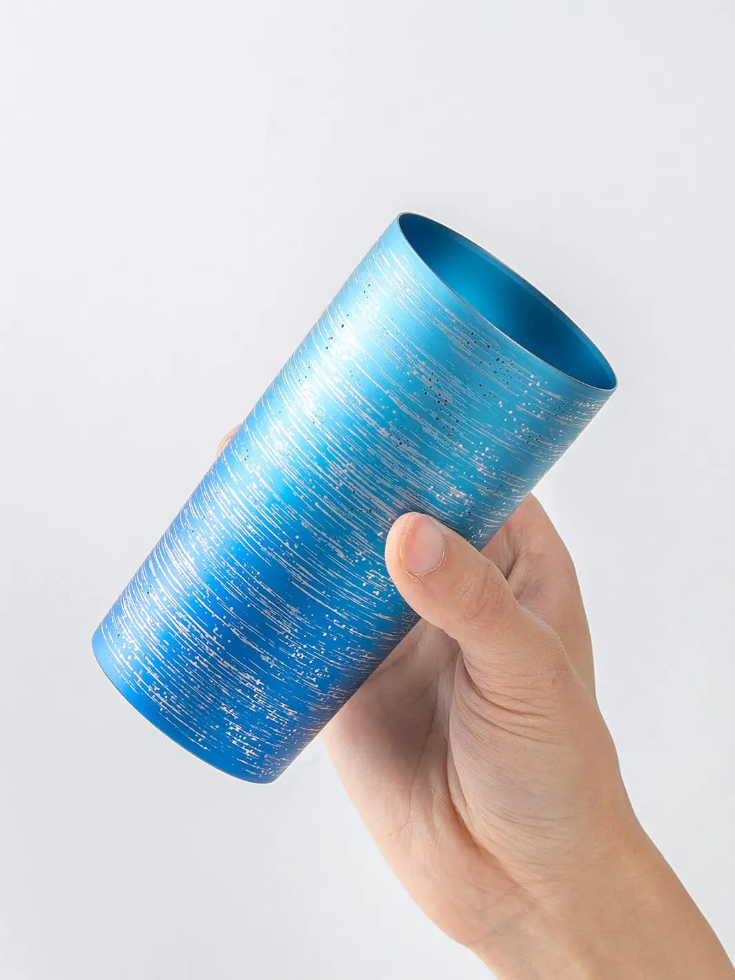 Slightly top-angled view of HORIE Ryo Ocean Blue tumbler (350ml) in hand