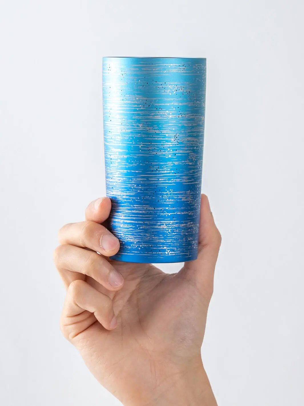 HORIE Ryo Ocean Blue titanium tumbler (350ml) held in hand, front view
