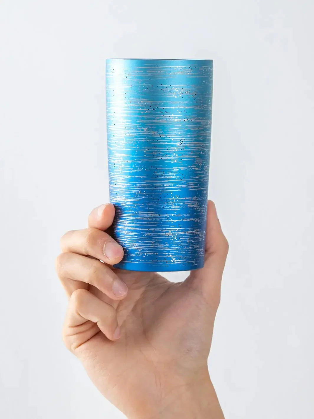HORIE Ryo Ocean Blue titanium tumbler (350ml) held in hand, front view