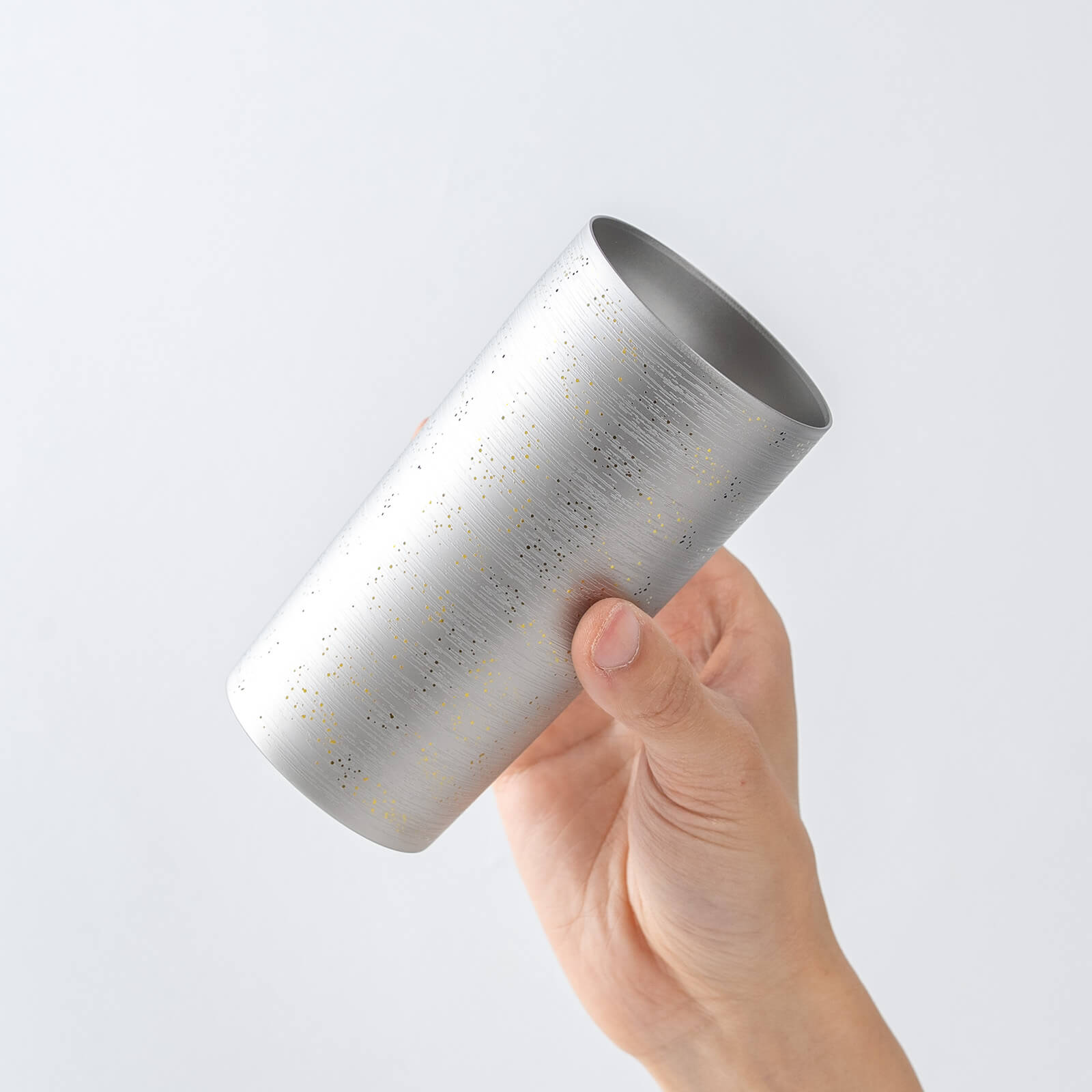 Slightly top-angled view of HORIE Ryo Silver Mist tumbler (350ml) in hand