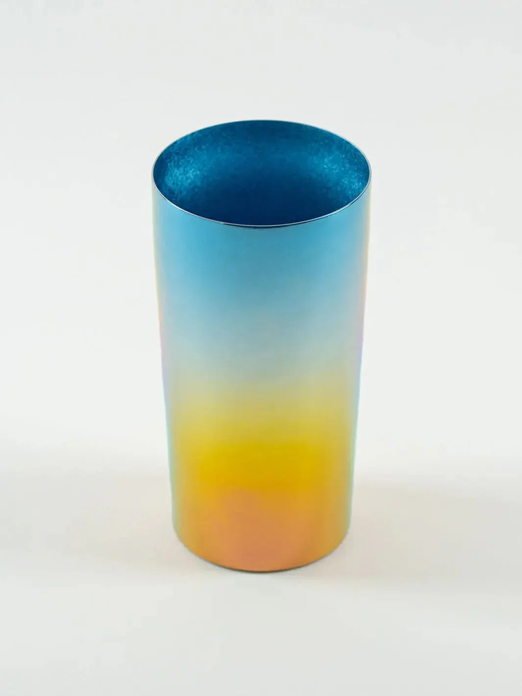 Top-angled view of HORIE Saiko rainbow titanium tumbler (350ml), showing vibrant gradient
