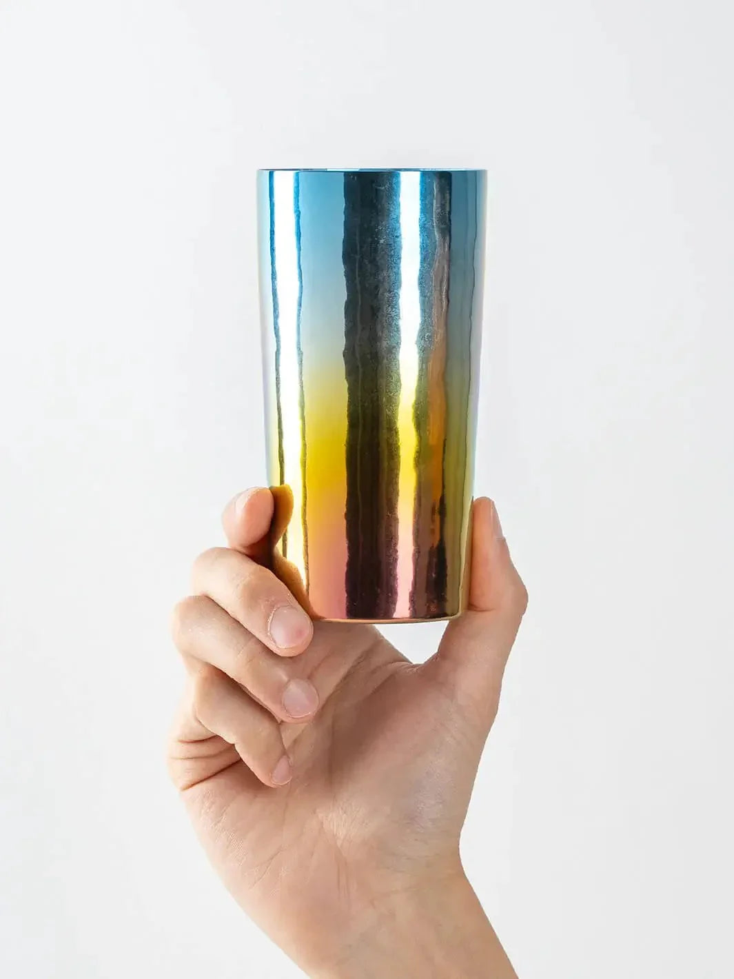 HORIE Saiko rainbow titanium tumbler (350ml) held in hand, front view