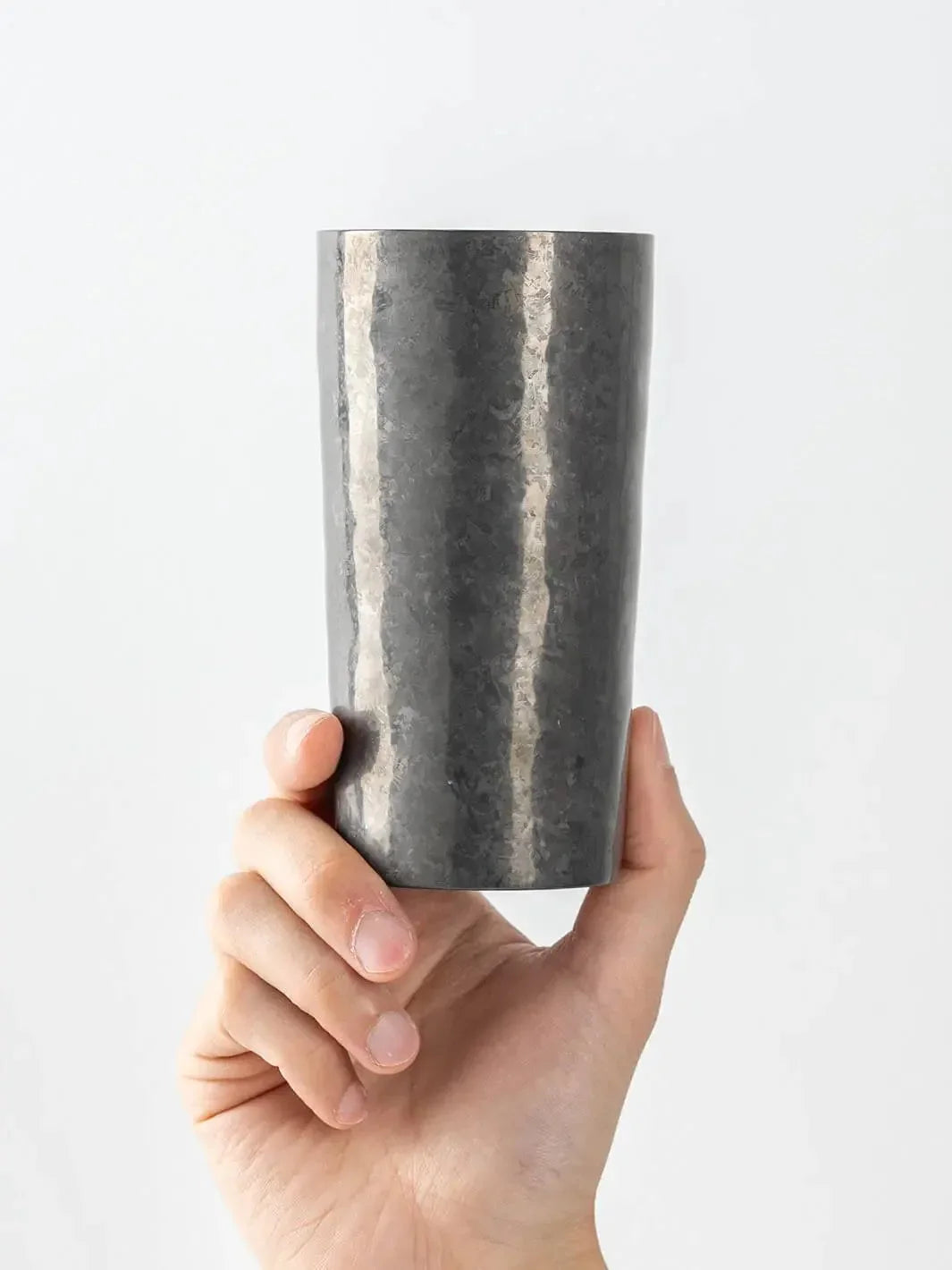 Black HORIE titanium tumbler (handheld, front view)