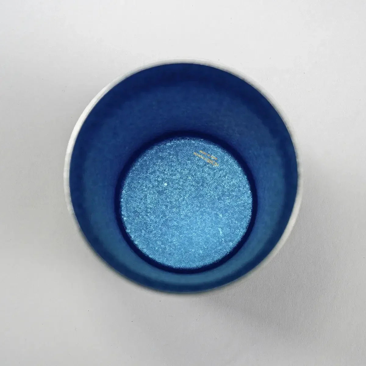 Side view of the HORIE Sandalwood Series Double-Walled Titanium Tumbler in blue, emphasizing its elegant finish.