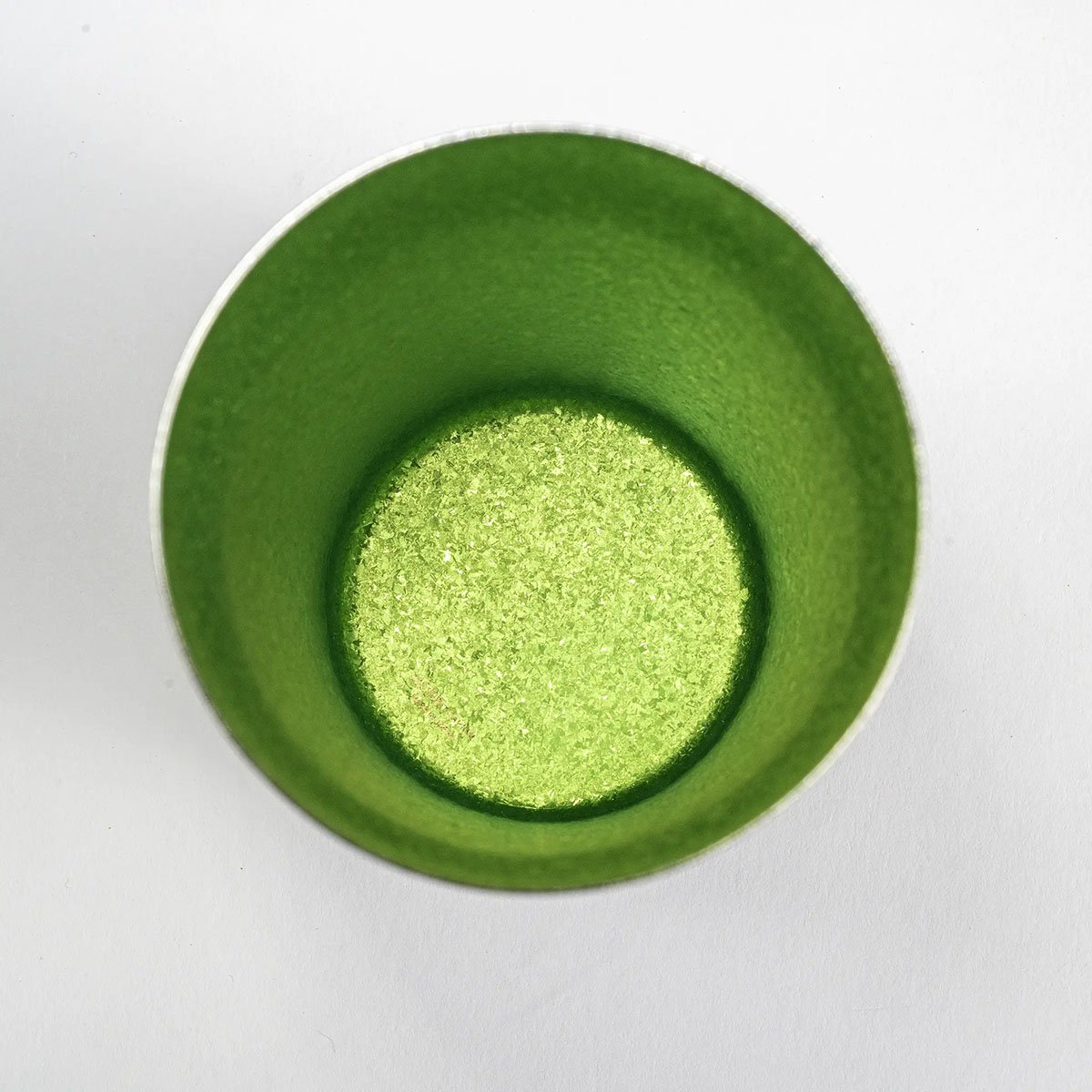 Side view of the HORIE Sandalwood Series Double-Walled Titanium Tumbler in green, showcasing the smooth, elegant surface.