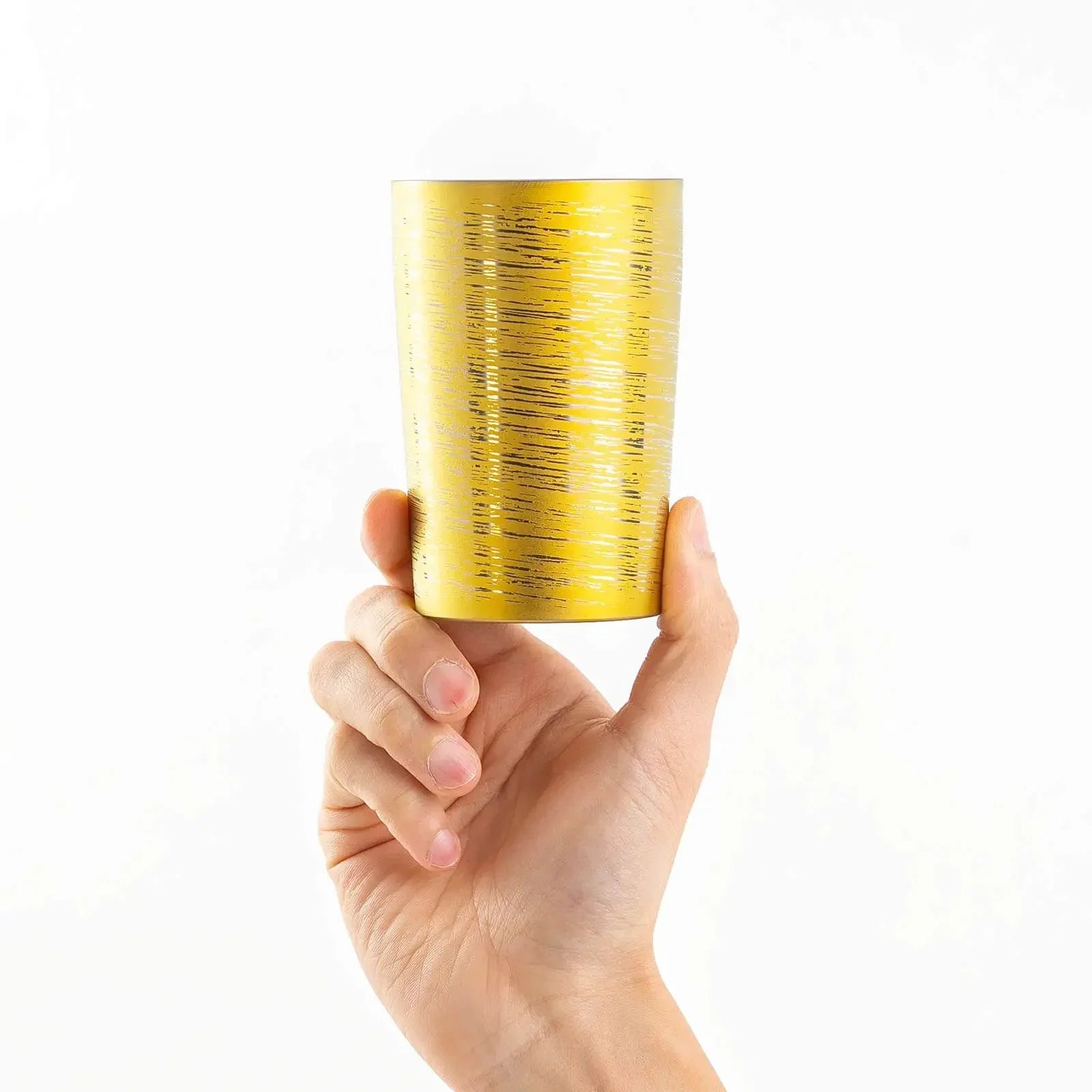 Lightweight 270ml gold titanium tumbler, hand-held front view, HORIE Shirakaba Series