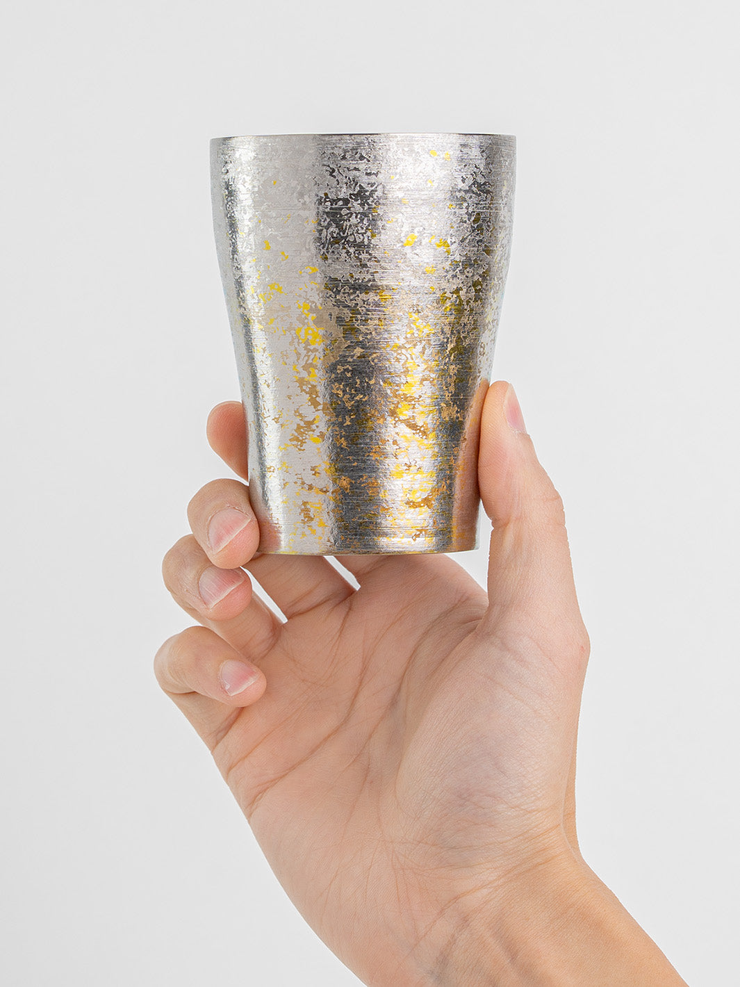 Silver titanium tumbler held from front, Japanese design