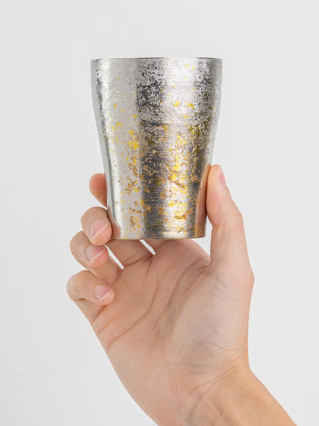 Silver titanium tumbler held from front, Japanese design