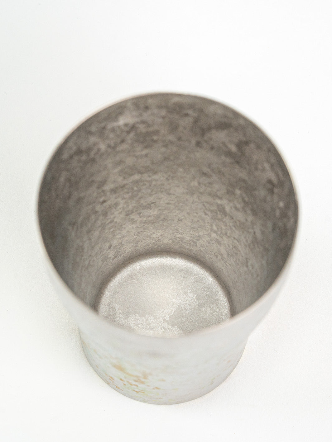 Inside of silver titanium tumbler, minimalist finish