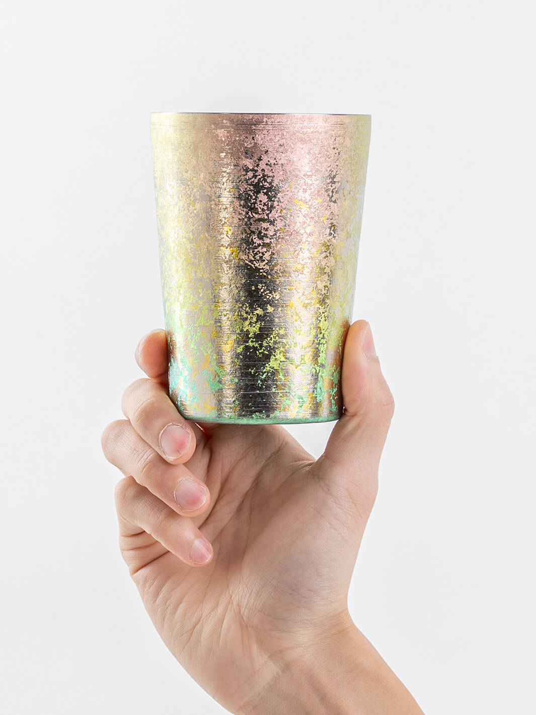 Pink titanium tumbler held upright in hand, 400ml