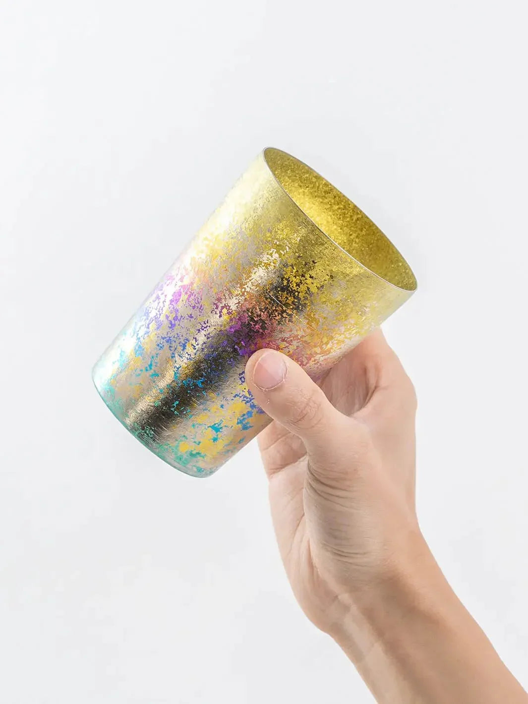 Angled hand-held view of rainbow HORIE tumbler