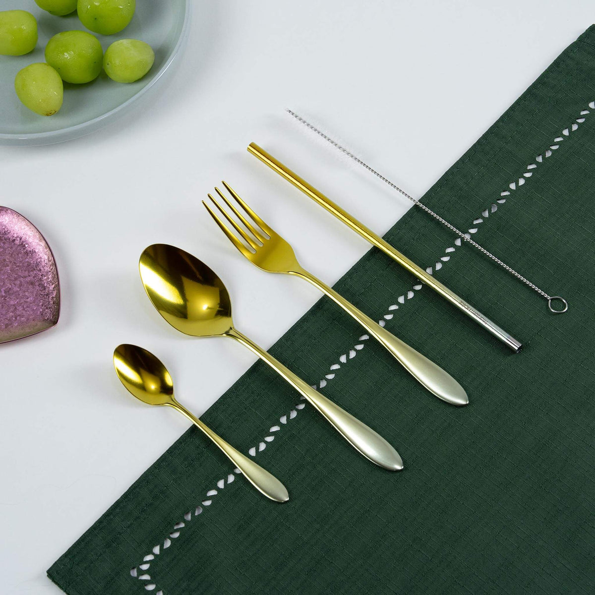 Gold HORIE pure titanium cutlery set arranged on a Japanese magazine