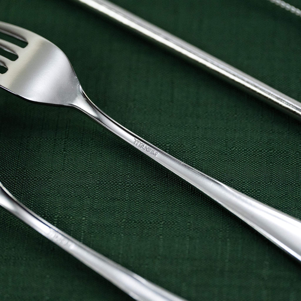 Close-up of the natural silver HORIE pure titanium dessert fork