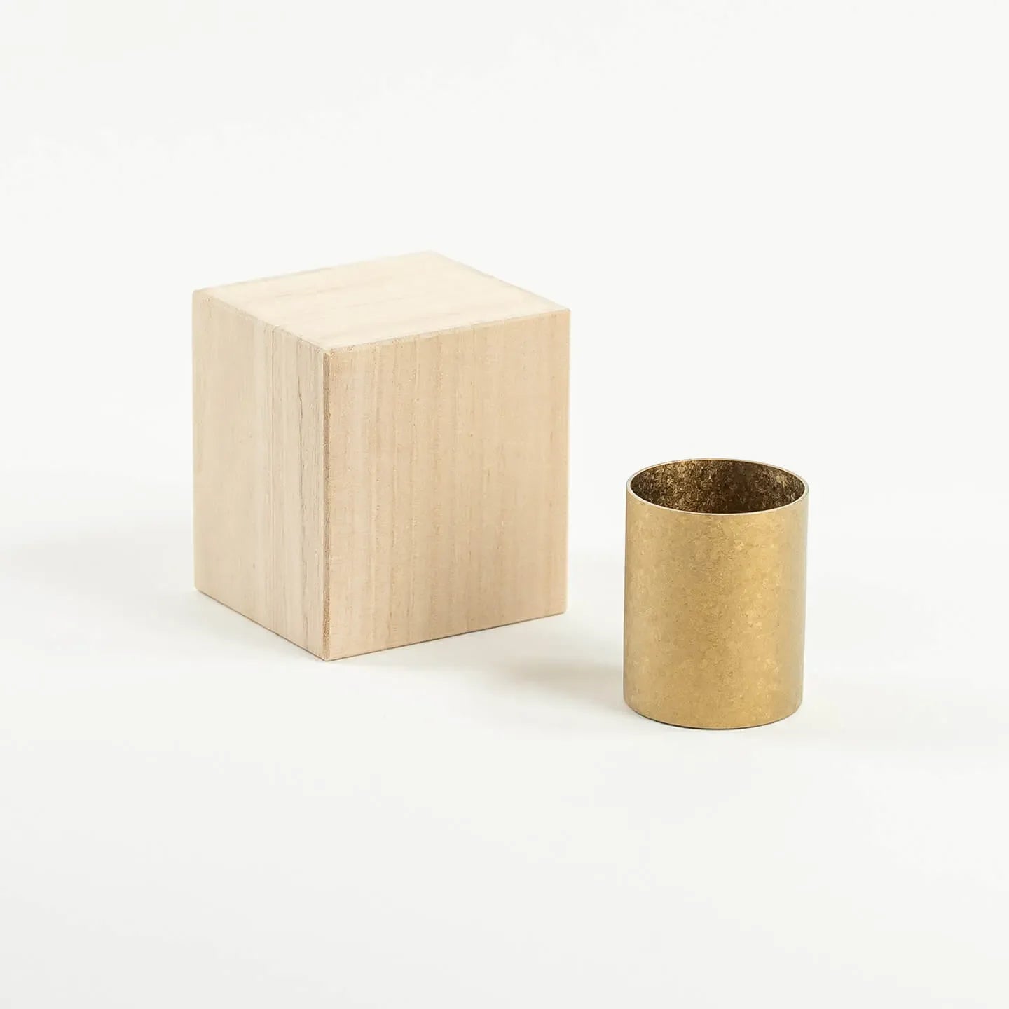 The HORIE Titanium Sake Cup (Gold) shown with its luxury paulownia wood gift box.