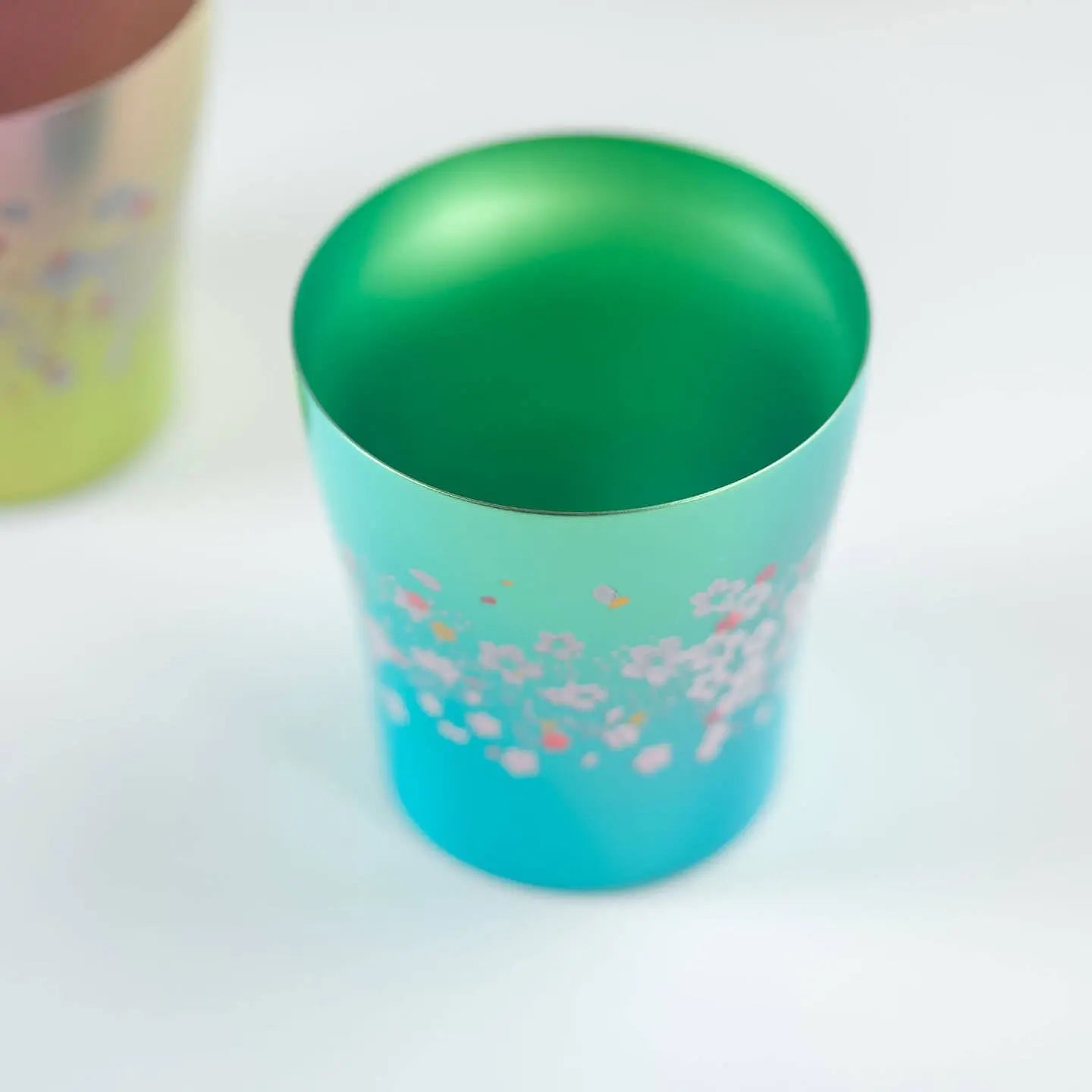 Overhead view of the interior of the green HORIE Sakura Saku titanium tumbler.