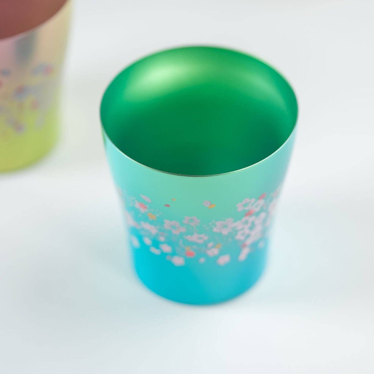 Overhead view of the interior of the green HORIE Sakura Saku titanium tumbler.