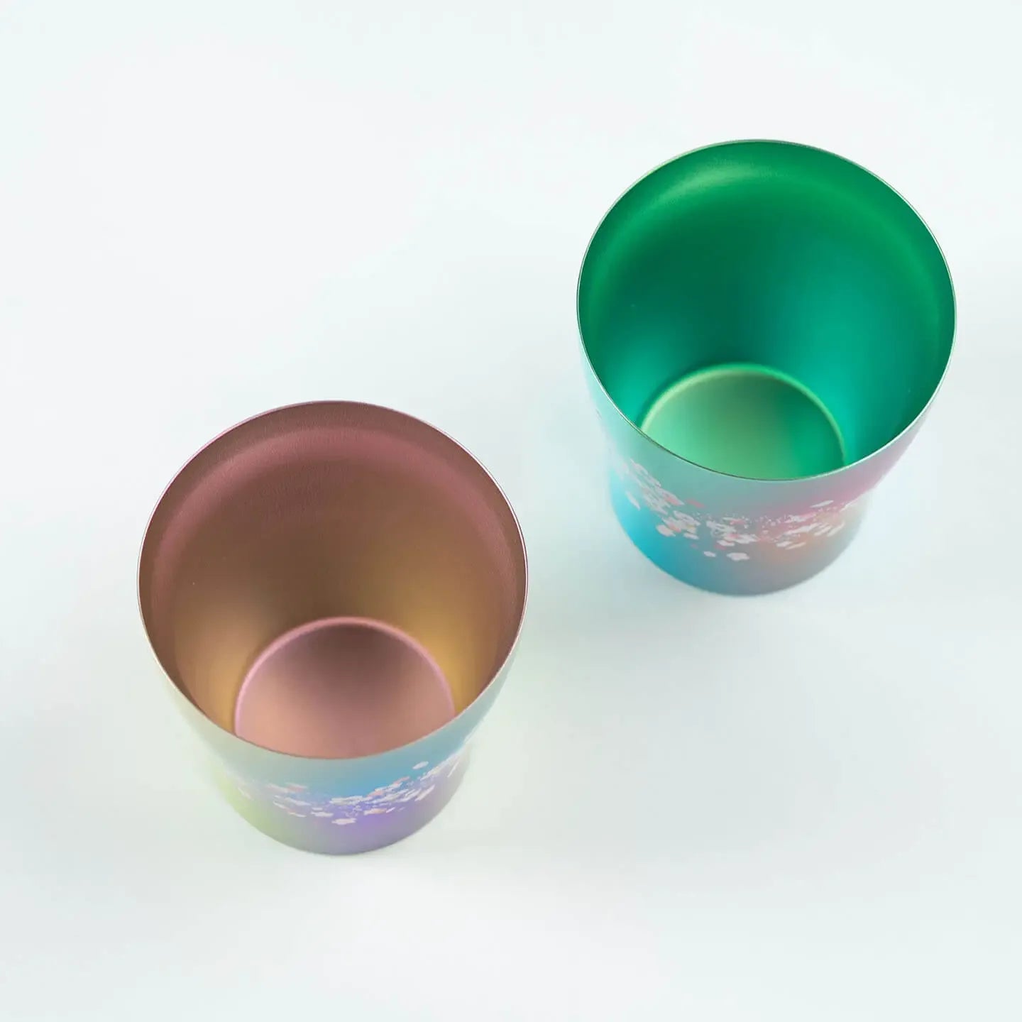 Top-down view showing the interior of the HORIE Sakura Saku pink and green tumblers.