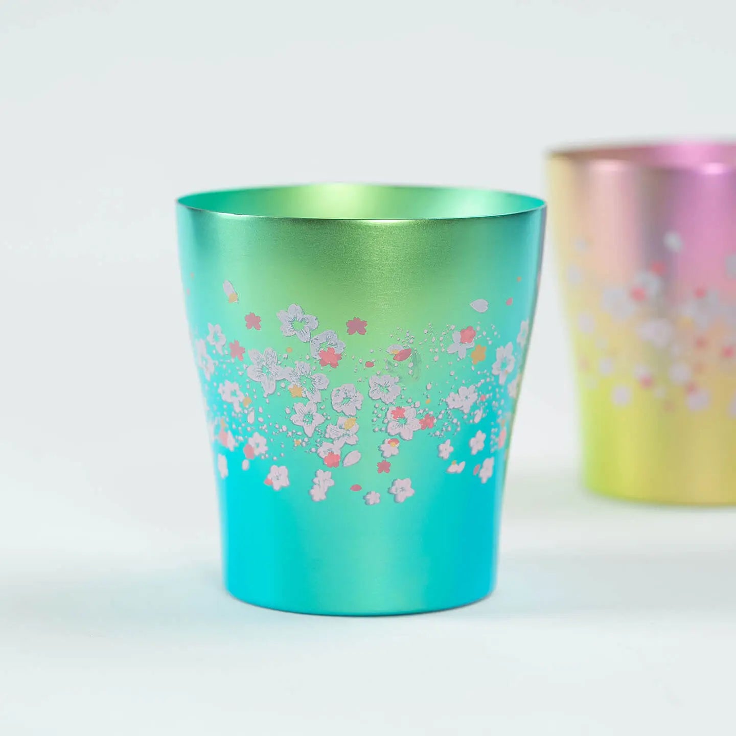 Front view of the green HORIE Titanium Tumbler Hana Series Sakura Saku (250ml).