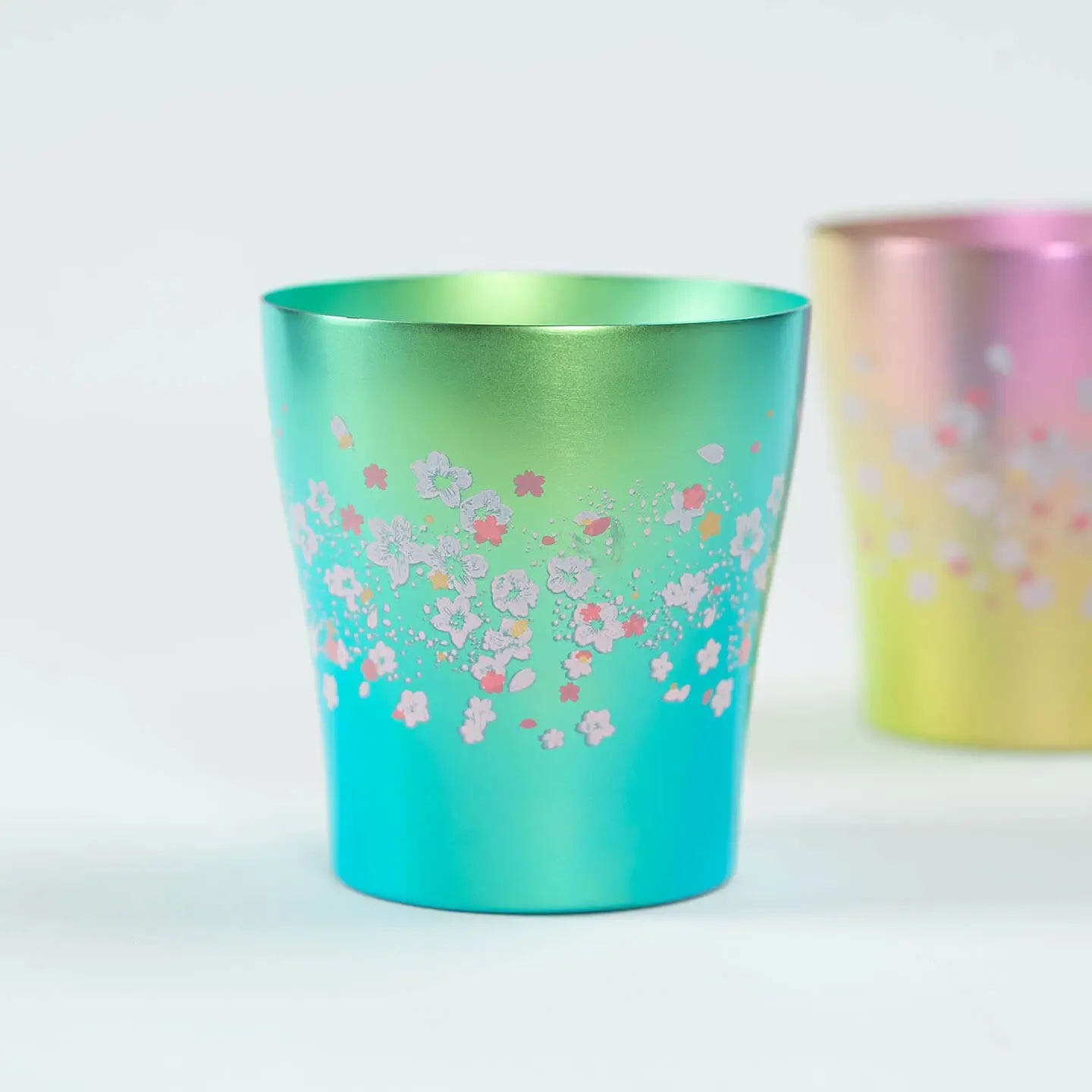Front view of the green HORIE Titanium Tumbler Hana Series Sakura Saku (250ml).