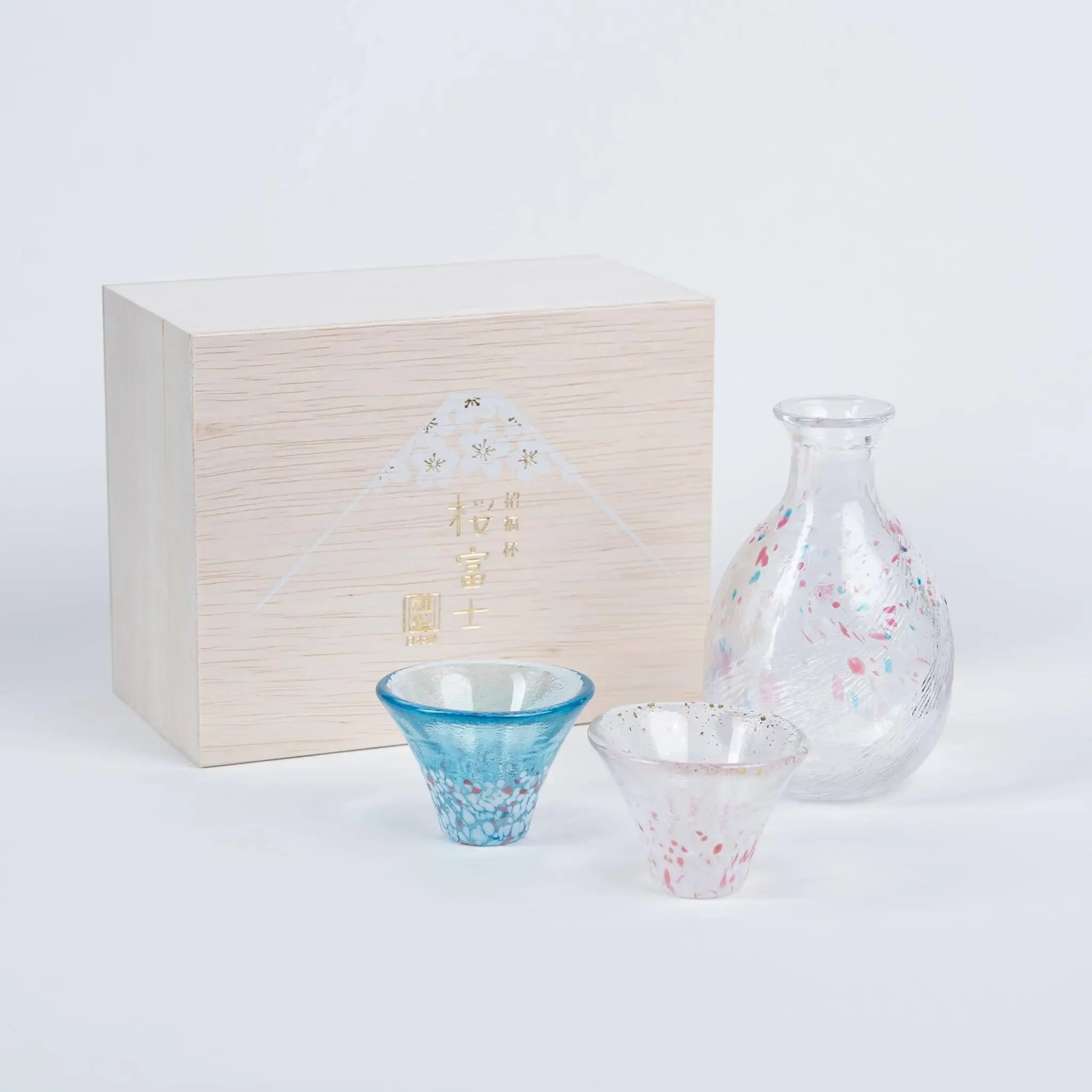 Premium Japanese sake set with cherry blossom and Mount Fuji motif, handmade glassware in wooden gift box.