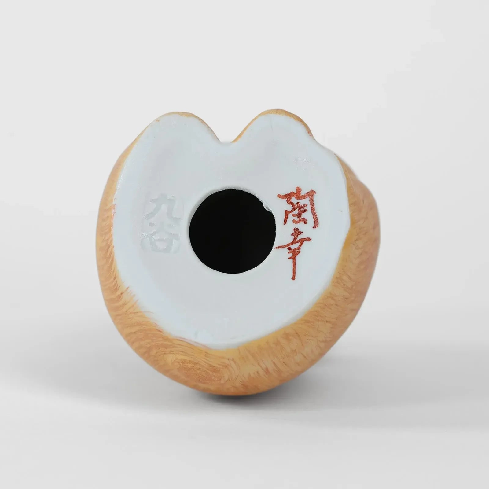 Bottom view of 10cm Kutani-yaki lucky cat, detailed ceramic finish.