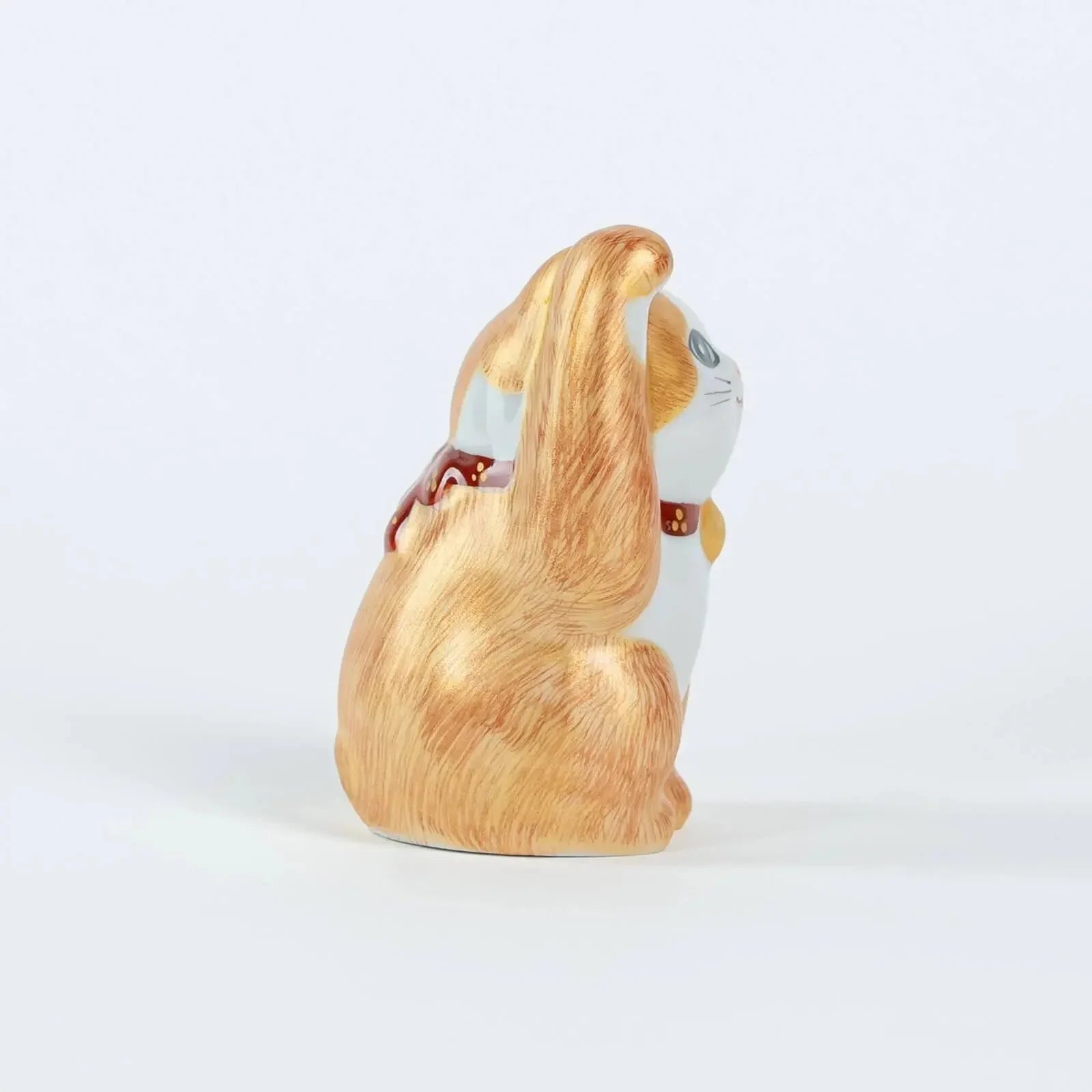 Traditional Kutani ceramic lucky cat, 10cm tall – right side view.
