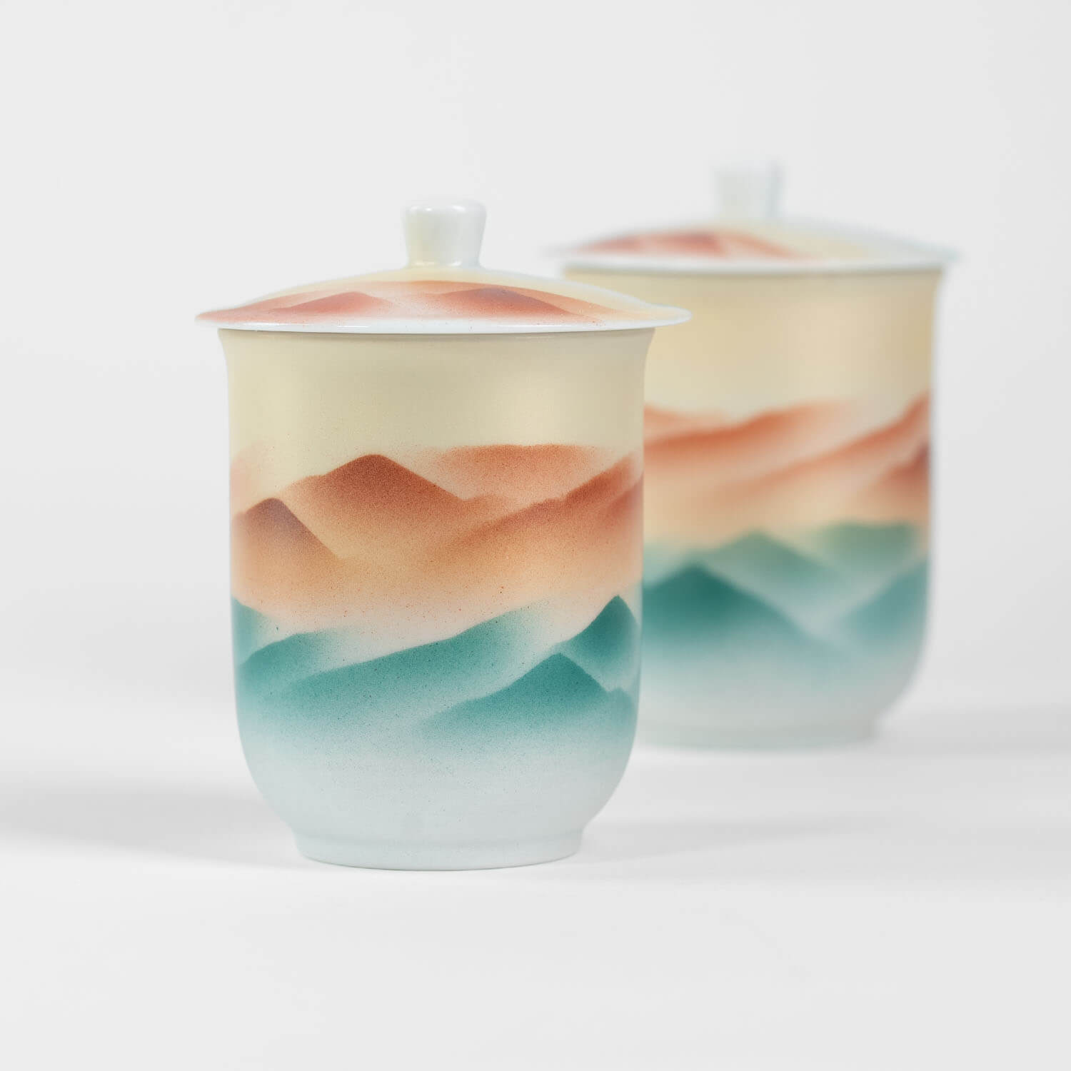 Kutani-yaki Japanese lidded teacup with hand-painted mountain landscape design