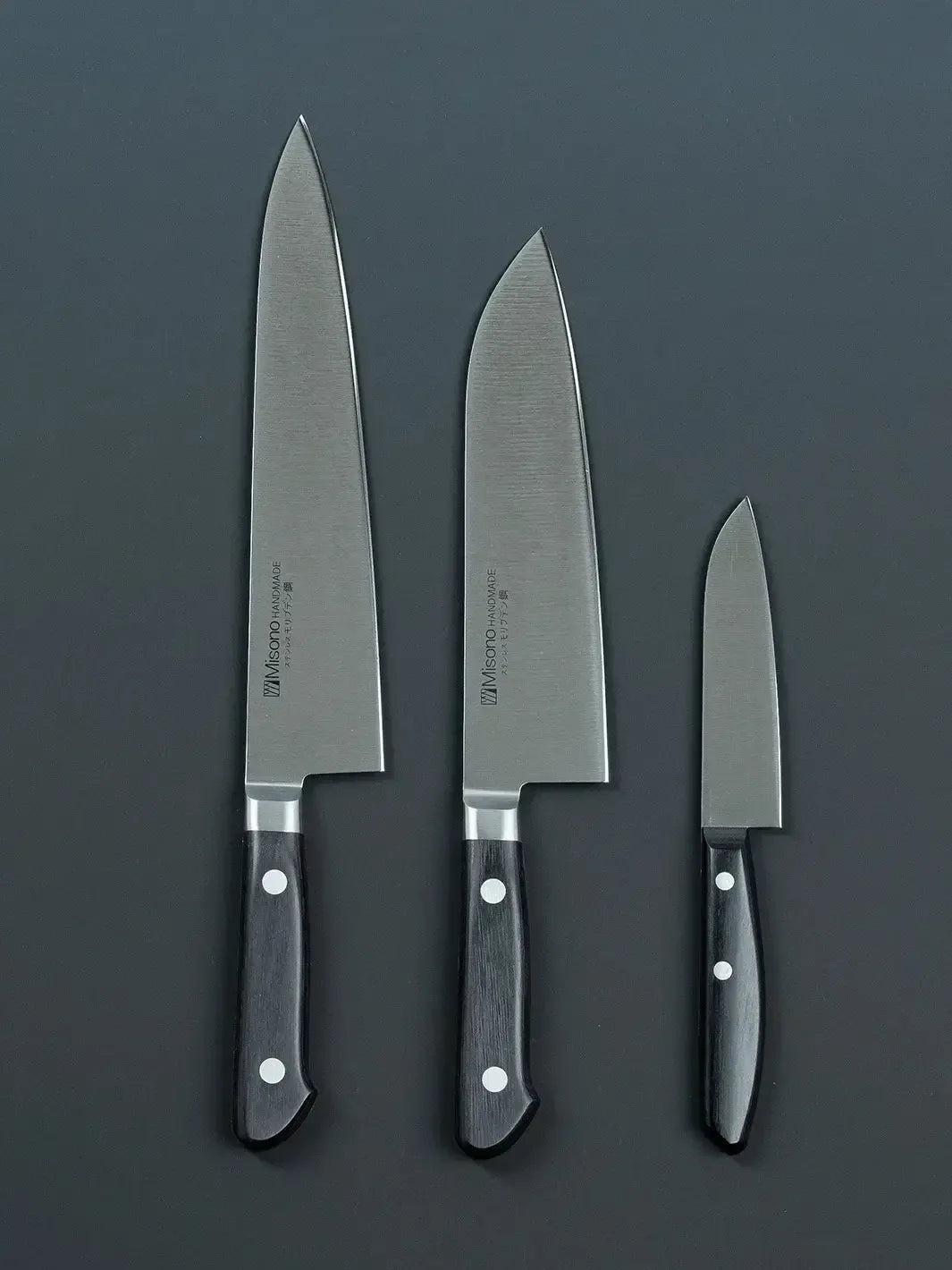 Front view of the Misono gyuto, santoku, and petty knives, highlighting the blade design and brand logo.
