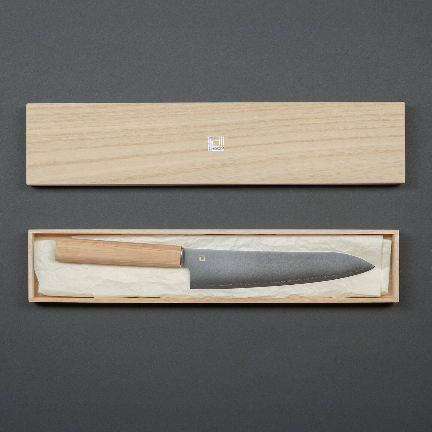 Shizu Hamono chef knife displayed with its open wooden presentation box