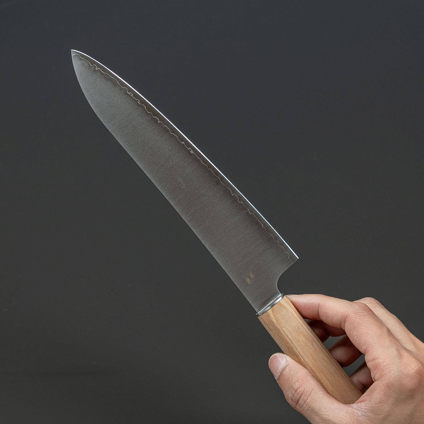 Side view of the Shizu Hamono chef knife held by hand