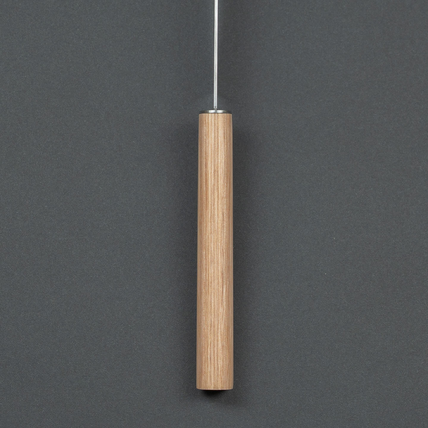 Close-up of the natural wooden handle and bolster of the Shizu Hamono chef knife