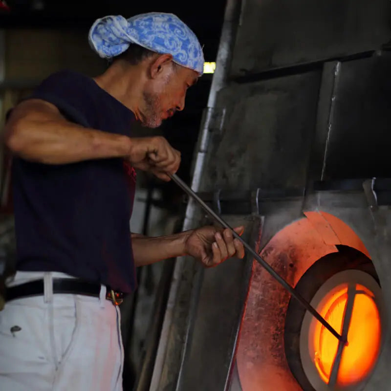 suntory x sghr spiral whiskey glass in kiln during glassblowing
