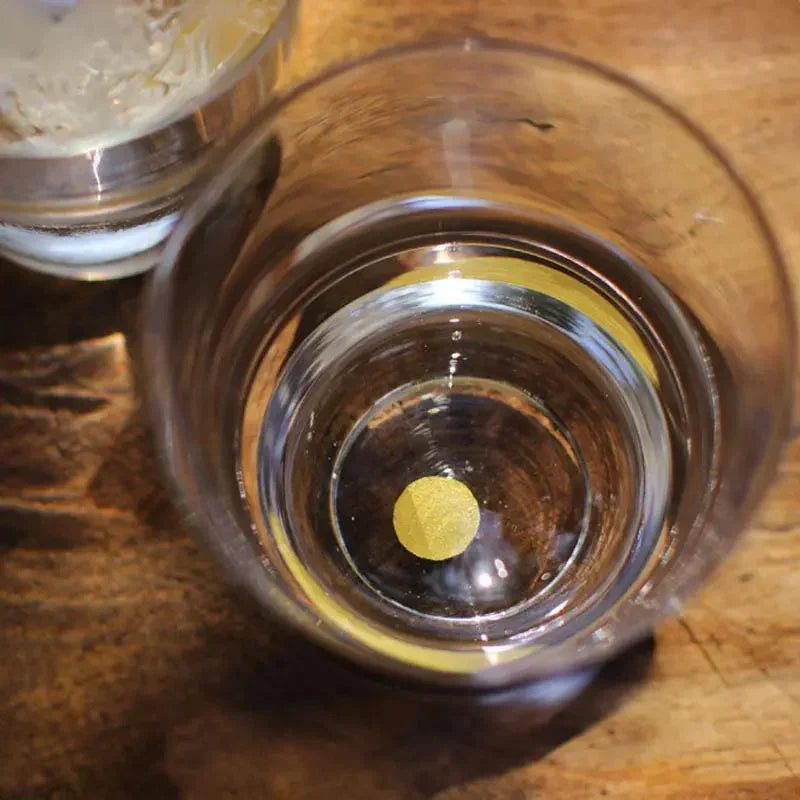 top view of suntory x sghr tsukimi rock glass showing gold leaf moon design