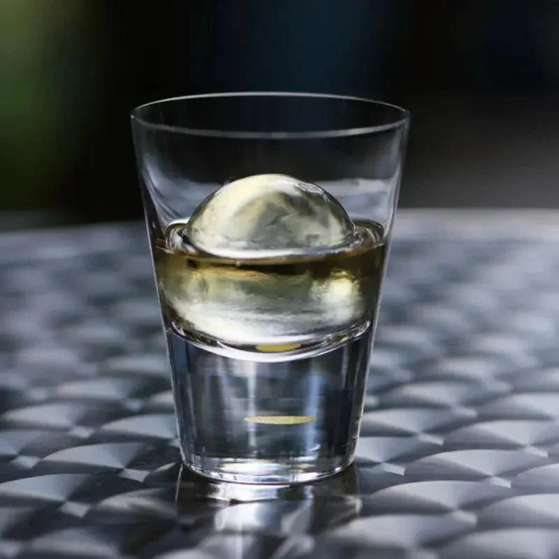 top view of suntory x sghr tsukimi rock glass showing gold leaf moon design