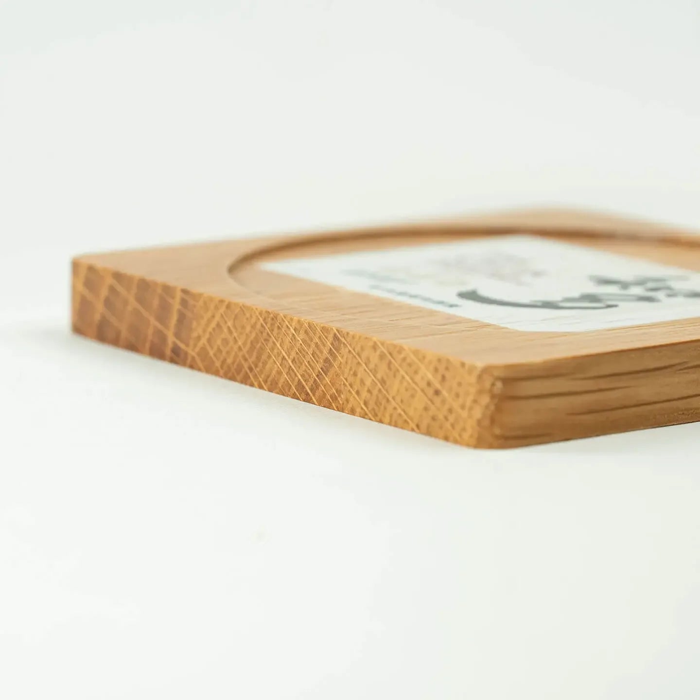 The square The Chita cask oak coaster, featuring the classic Japanese single grain whisky label design.